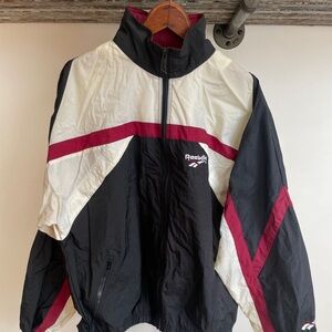 Vintage 1980’s Reebok workout jacket. Size medium. Logo zip and stowaway hood